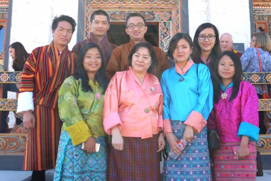 Kunzang C. Namgyel poses with Bhutanese students at the unveiling of the Lhakhang. 