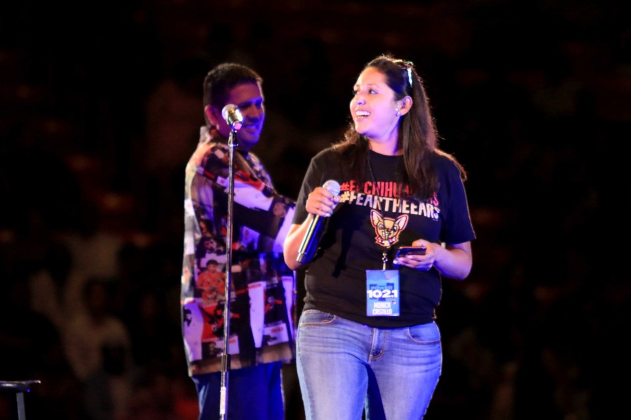 Radio DJ from Power 102, Monica Castillo punmps up the crowd for the comedians. 