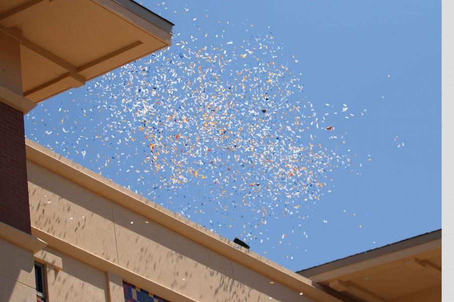 The event ended its grand opening with blue and orange confetti. 