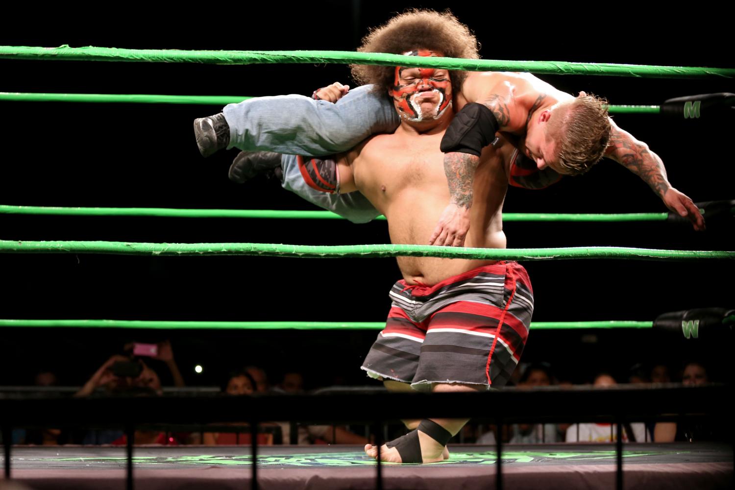 King Samoa spins around while carrying MCW champion Cowboy Kid Quick.