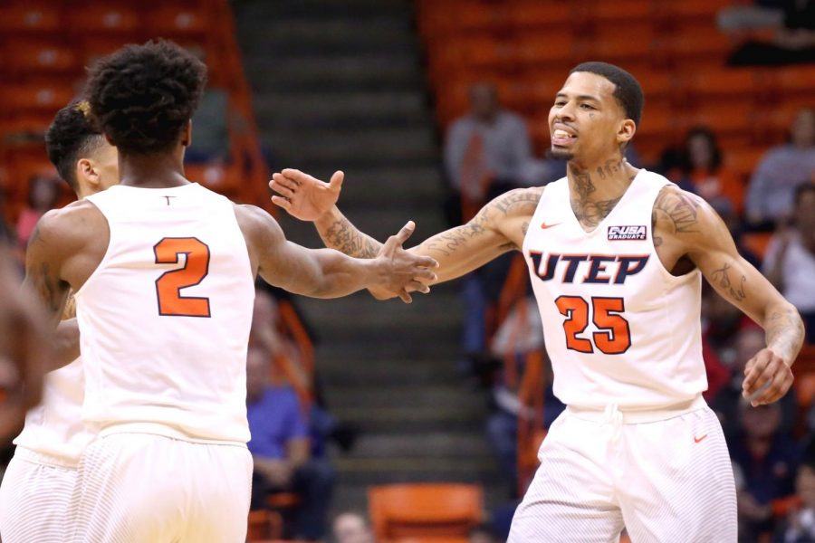 The UTEP back court of Omega Harris and Keith Frazier dab each other up as they lead the Miners to victory.