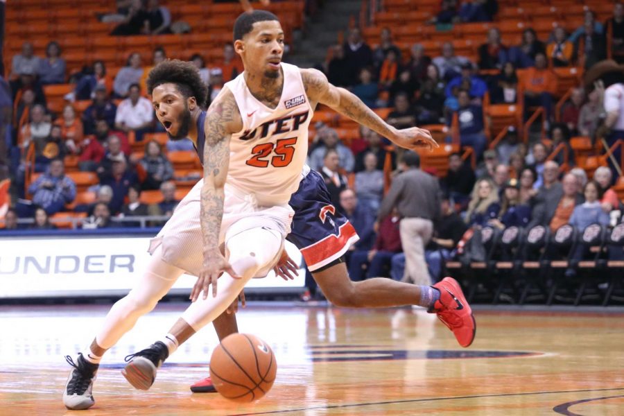 Keith Frazier crosses over his defender as he leads the Miners to victory.