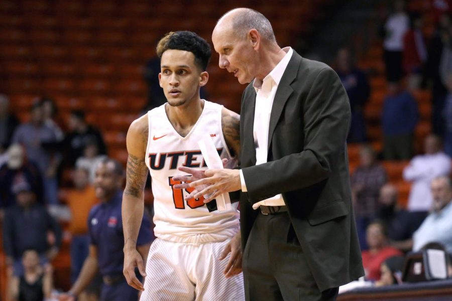 Interim head coach Phil Johnson talks to Kobe Magee about attacking the Bisons defense.   