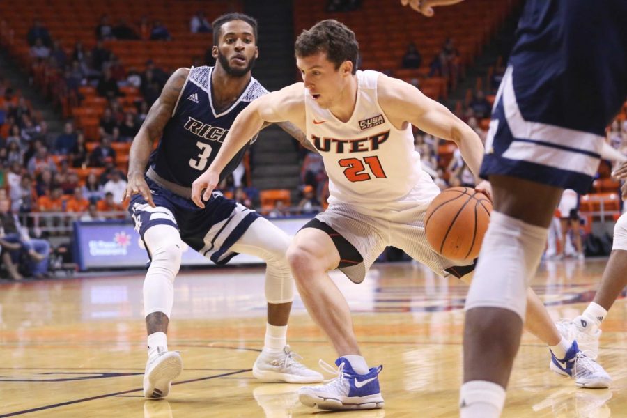 Trey Touchet drives past the defender as he finished with eight points. 