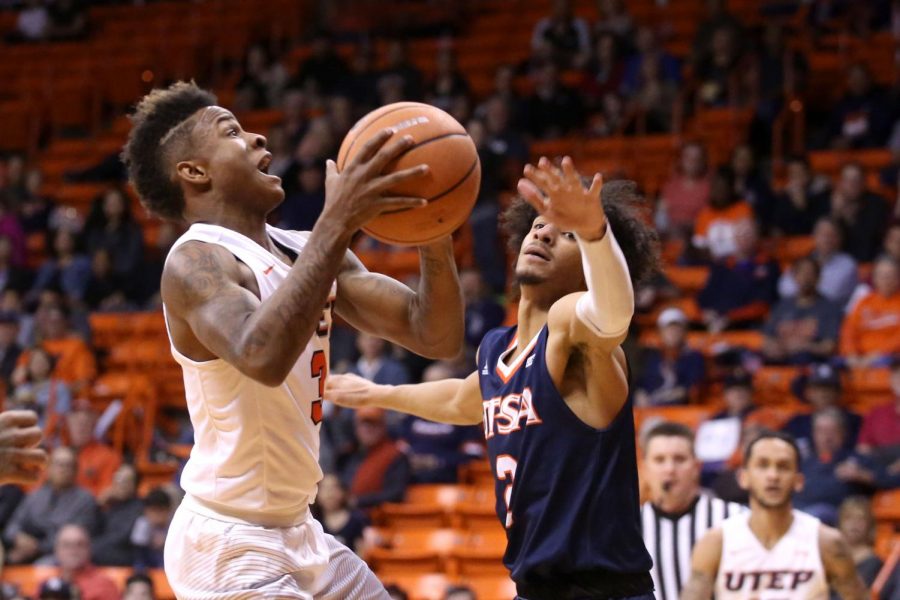 Evan Gilyard drives to the hole as he gets fouled for two. 