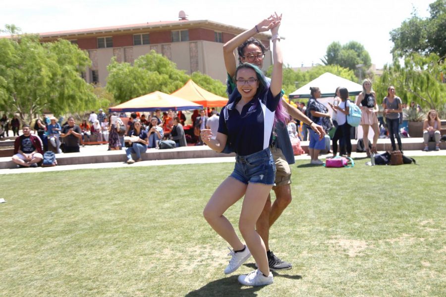 Students dance to 'Como La Flor' which was performed by Elia Esparza at the first Miner Fest  on Wednesday, April 18 at Centennial Plaza. 