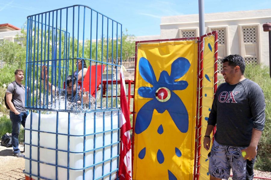 A frat member is dunked by a student at the first Miner Fest on Wednesday, April 18 at 