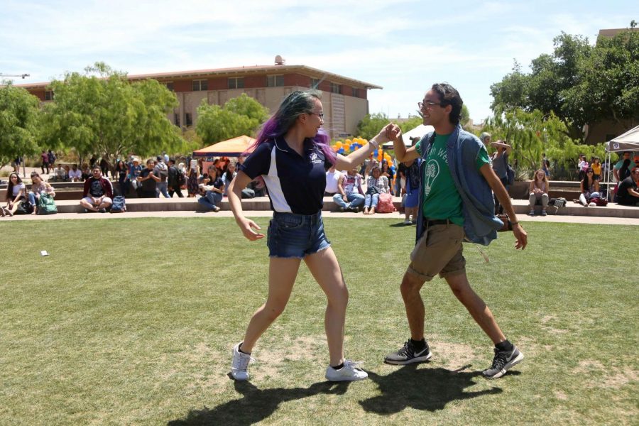 Students dance to 'Como La Flor' which was performed by Elia Esparza at the first Miner Fest  on Wednesday, April 18 at Centennial Plaza. 