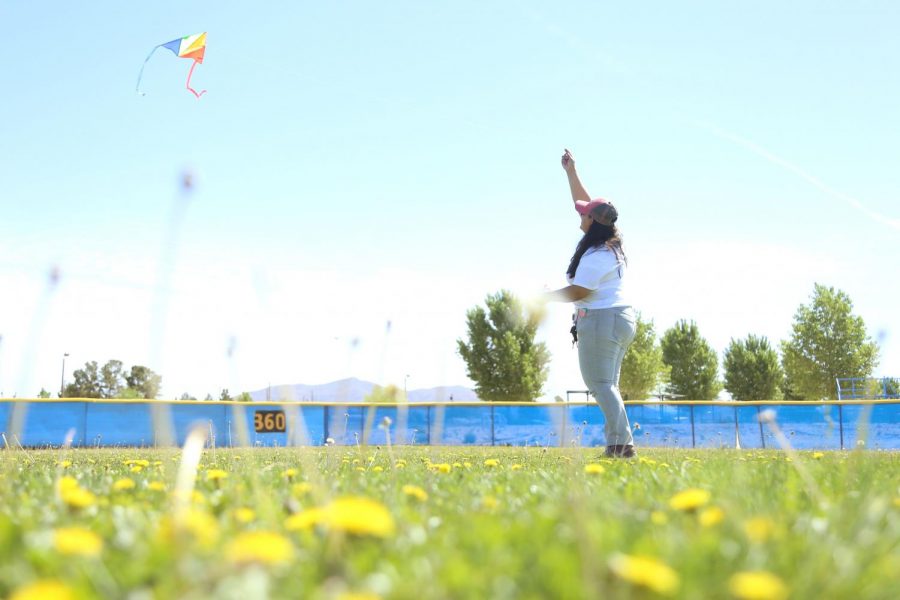 Voices United Executive Director Ambar M. Gutierrez flies a kite at the first annual Kite Festival on Saturday, May 19, at Ernie Rascon Memorial Park. 