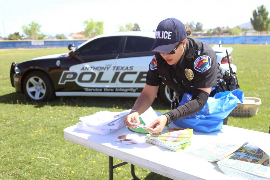 The Anthony, Texas Police Department hands coloring books and stickers with helpful information at the first annual Kite Festival on Saturday, May 19, at Ernie Rascon Memorial Park.  