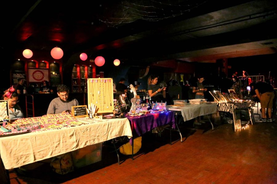 Local venders set up their tables for the Last Thursdays Art Market at Tricky Falls.