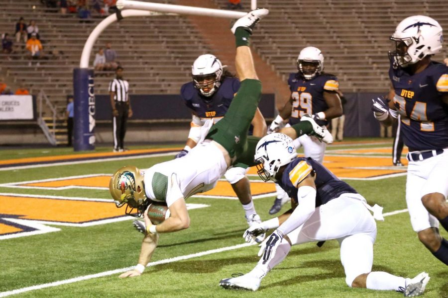 UAB's Senior quarterback A.J. Erdely is tackled by senior defensive back Nik Needham at the goaline