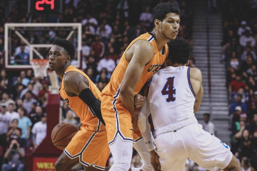 Senior forward Paul Thomas blocks NMSU  senior guard Clayton Henry. 