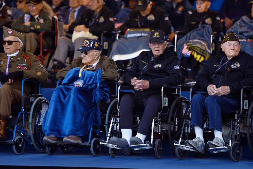 Photo courtesy of Christian Hartmann/Reuters. Elderly vets watch as celebrations for the anniversary of D-Day commence.