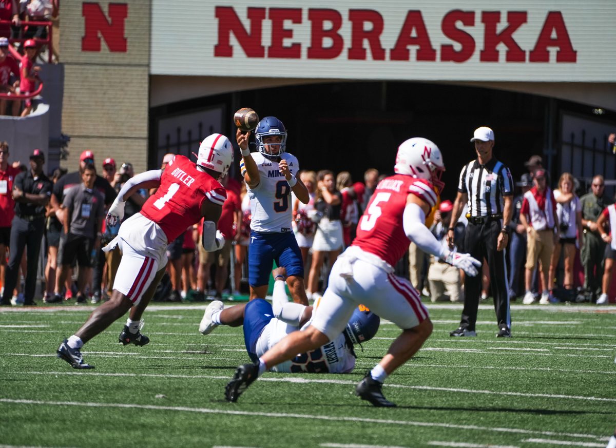 Sophomore quarterback Skylar Locklear maneuvers Nebraska’s defense from a received pass.