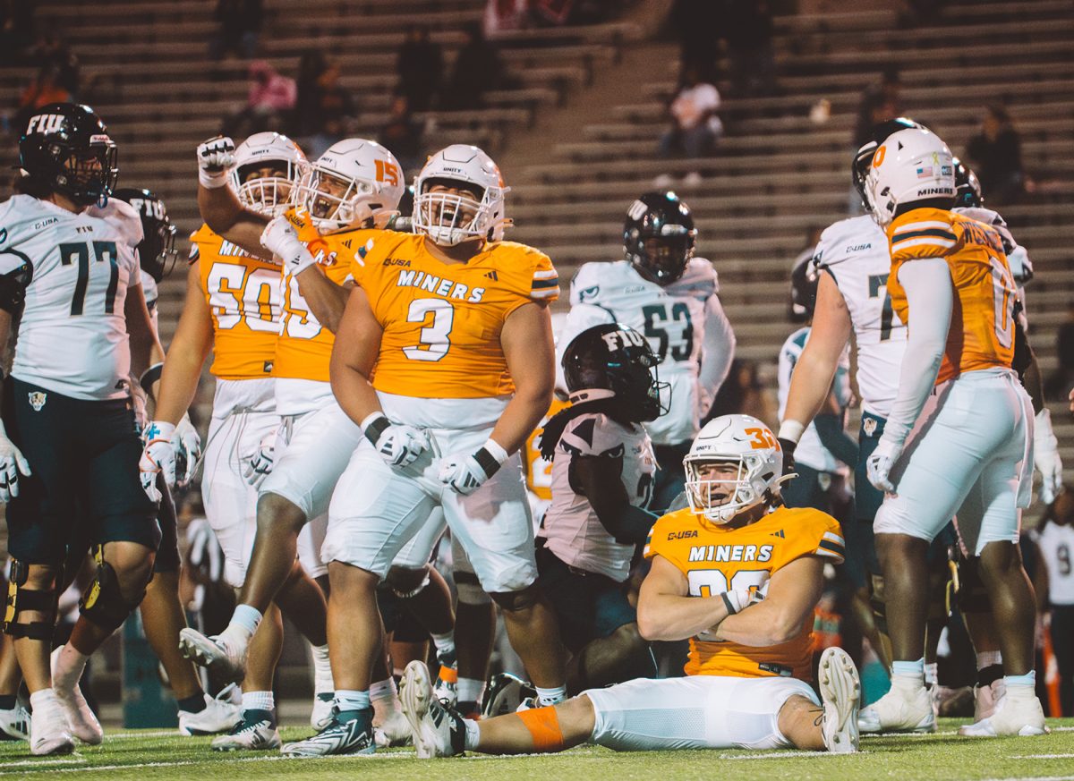 The UTEP football team celebrating a tackle against FIU.