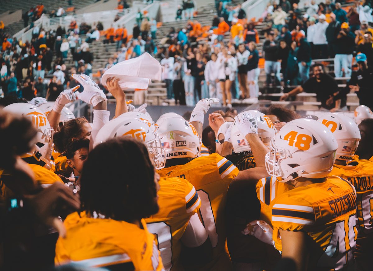 The UTEP football team celebrating its first victory of the season.