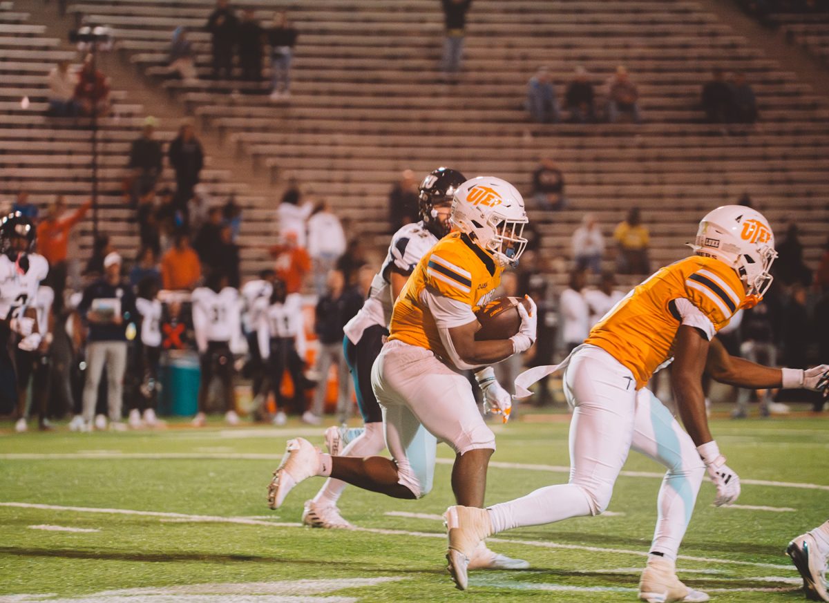 UTEP player runs while carrying the ball to score a touchdown. 