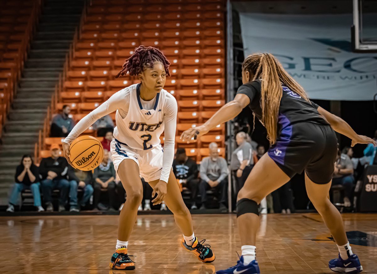 Junior guard Heaven Samayoa-Mathis dribbles against Tarleton's defender.