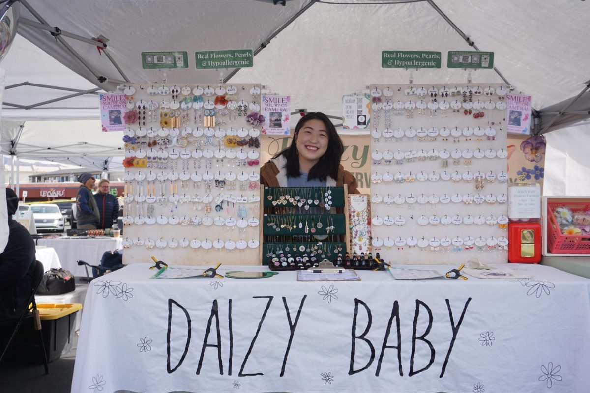 Crystal Lee, 24, owner of Daizy Baby displays unique handmade jewelry made of resin and real flowers that are locally sourced.