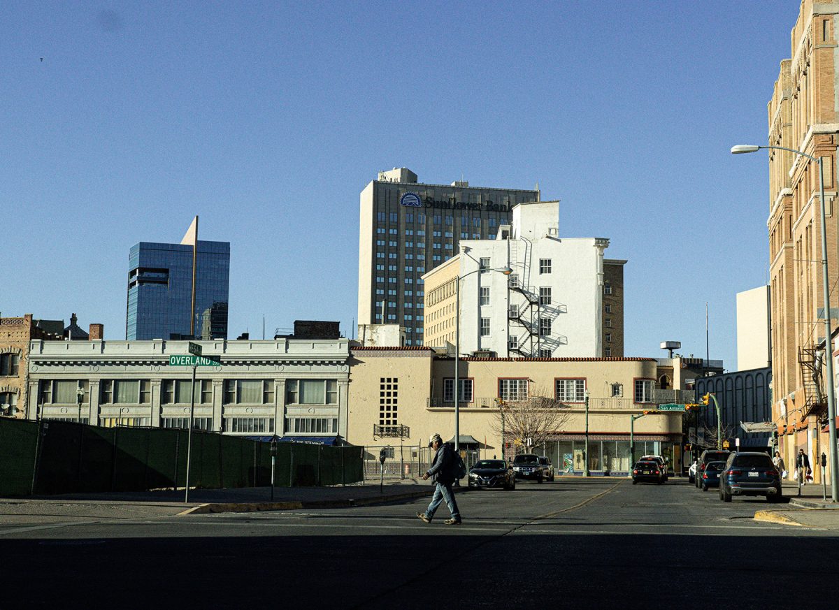 Pedestrian walks in downtown El Paso where small businesses are struggling to keep up with higher rents.