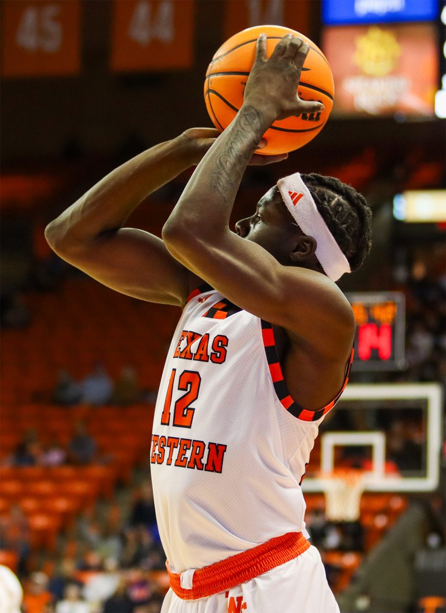 UTEP guard Ahamad Bynum (12) attempting a shot to bring up UTEP's score in the first half.