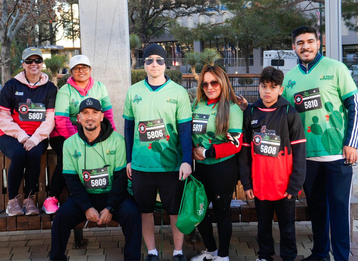 A group of Spine & Rehab Specialists 5K  runners gather before the start of their race.