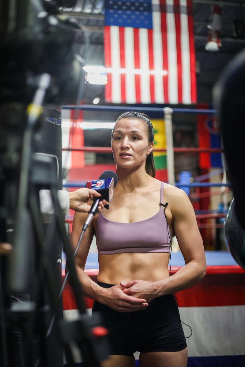 Stephanie Han talks to the press after her work out ahead of her fight at the Warriors Edge boxing gym on Feb. 20.